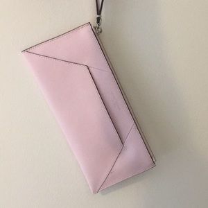 Pink envelope clutch with wrist strap